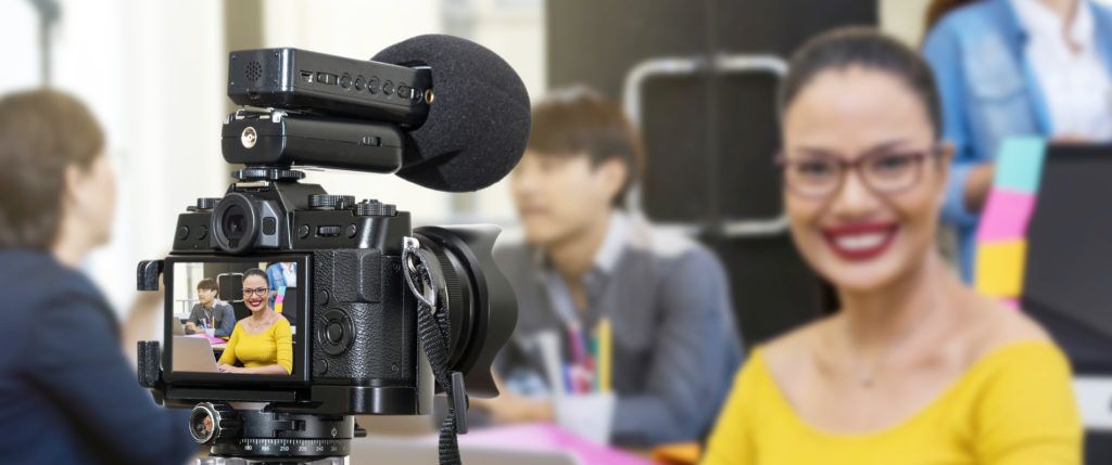 Woman wearing bright colors for corporate video shoot in Dallas